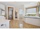 Elegant bathroom with a large soaking tub and walk-in shower at 1175 Ridge Oaks Dr, Castle Rock, CO 80104