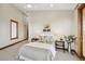 Cozy bedroom with a comfortable bed and ample natural light at 1175 Ridge Oaks Dr, Castle Rock, CO 80104