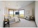 Spacious bedroom with stunning views and a sitting area at 1175 Ridge Oaks Dr, Castle Rock, CO 80104