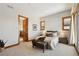 Serene bedroom with a plush bed and access to another room at 1175 Ridge Oaks Dr, Castle Rock, CO 80104