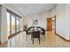 Elegant dining room with large windows and granite floor at 1175 Ridge Oaks Dr, Castle Rock, CO 80104