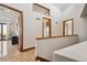 Bright hallway with wood flooring and access to bedrooms at 1175 Ridge Oaks Dr, Castle Rock, CO 80104