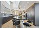 Modern kitchen with dark cabinetry, granite counters and island at 1175 Ridge Oaks Dr, Castle Rock, CO 80104