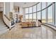 Open concept living area with large windows and high ceilings at 1175 Ridge Oaks Dr, Castle Rock, CO 80104