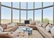 Spacious living room with panoramic windows and comfortable seating at 1175 Ridge Oaks Dr, Castle Rock, CO 80104