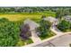 Expansive aerial view of a home with a well-manicured lawn and mature trees in a desirable neighborhood at 12164 Adams St, Thornton, CO 80241