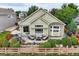 Charming backyard featuring a patio with cozy seating, lush landscaping, and a peaceful atmosphere for outdoor enjoyment at 12164 Adams St, Thornton, CO 80241
