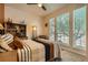 Sunlit bedroom with large windows, modern decor and a comfortable bed at 12164 Adams St, Thornton, CO 80241
