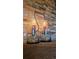 Close up of candles in glass holders set on a shelf in front of a stone wall at 12164 Adams St, Thornton, CO 80241
