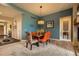 Dining room with modern chairs and fixtures that adds a splash of color at 12164 Adams St, Thornton, CO 80241