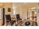 Home entryway featuring hardwood floors and a carpeted sitting area at 12164 Adams St, Thornton, CO 80241