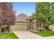 Charming stone home with a manicured lawn and mature trees offers great curb appeal at 12164 Adams St, Thornton, CO 80241