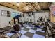 Basement gym features exercise equipment and weights, promoting a healthy lifestyle at 12164 Adams St, Thornton, CO 80241