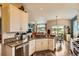 Bright kitchen with granite countertops, stainless steel appliances, and an eat-in dining area at 12164 Adams St, Thornton, CO 80241