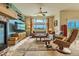Inviting living room with stylish furniture, ceiling fan, large window and beautiful views at 12164 Adams St, Thornton, CO 80241