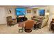 Comfortable living room featuring plush seating, a modern TV, and tasteful decor at 12164 Adams St, Thornton, CO 80241