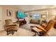 Comfortable living room with plush seating and a large TV at 12164 Adams St, Thornton, CO 80241