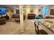 Basement with a comfortable seating area, piano, and a convenient wet bar for entertaining at 12164 Adams St, Thornton, CO 80241