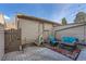 Cozy patio with comfortable seating and a decorative rug, perfect for outdoor relaxation at 6914 E Briarwood Dr, Centennial, CO 80112
