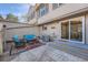 Private patio with stylish outdoor furniture and an entry door, ideal for entertaining or relaxation at 6914 E Briarwood Dr, Centennial, CO 80112