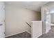Upstairs hallway featuring neutral walls and plush carpeting at 6914 E Briarwood Dr, Centennial, CO 80112