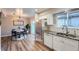 Modern kitchen with stainless steel appliances and adjacent dining area at 6914 E Briarwood Dr, Centennial, CO 80112
