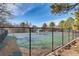Community tennis court surrounded by fencing and greenery, providing recreational opportunities for residents at 6914 E Briarwood Dr, Centennial, CO 80112
