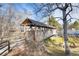 Charming covered walkway with a creek and greenery, perfect for scenic strolls at 6914 E Briarwood Dr, Centennial, CO 80112
