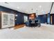 Basement area with a stylish bar area and doors to the outside at 1575 Ridgetrail Ct, Castle Rock, CO 80104