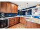 Basement bar with granite countertop and wine cooler at 1575 Ridgetrail Ct, Castle Rock, CO 80104