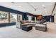 The basement features a cozy sectional, abundant natural light, and a convenient kitchenette at 1575 Ridgetrail Ct, Castle Rock, CO 80104
