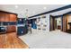 Finished basement boasting a bar, open layout, and integrated shelving for storage and display at 1575 Ridgetrail Ct, Castle Rock, CO 80104