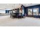 Basement area with a stylish bar area and a separate play space for children with plenty of natural light at 1575 Ridgetrail Ct, Castle Rock, CO 80104