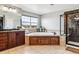 Bright bathroom with a soaking tub, separate shower, and dual sink vanity at 1575 Ridgetrail Ct, Castle Rock, CO 80104