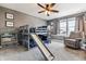 bedroom with bunk bed, slide, and built-in shelving at 1575 Ridgetrail Ct, Castle Rock, CO 80104