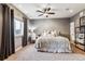 Bright bedroom with a comfortable bed and large window at 1575 Ridgetrail Ct, Castle Rock, CO 80104