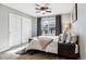 Cozy bedroom with a double bed, window, and ceiling fan at 1575 Ridgetrail Ct, Castle Rock, CO 80104