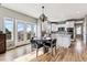 Bright eat-in kitchen features white cabinets, stainless appliances, an island, and access to an outdoor space at 1575 Ridgetrail Ct, Castle Rock, CO 80104