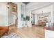 Open-concept living room with hardwood floors leading into the adjacent dining area at 1575 Ridgetrail Ct, Castle Rock, CO 80104