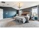 Large main bedroom with ample natural light, a bench, and neutral décor at 1575 Ridgetrail Ct, Castle Rock, CO 80104