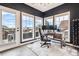 Bright home office featuring large windows, natural light, and views of the surrounding landscape at 1575 Ridgetrail Ct, Castle Rock, CO 80104