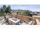 Inviting outdoor deck featuring a modern fire pit and comfortable seating with mountain views at 1575 Ridgetrail Ct, Castle Rock, CO 80104