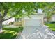 Well-maintained home with a two-car garage and driveway, showcasing curb appeal and outdoor space at 10231 Spotted Owl Ave, Highlands Ranch, CO 80129