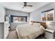 Comfortable bedroom featuring a cozy bed, natural light, and neutral color scheme at 1534 Rosemary St, Denver, CO 80220