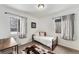 Well-lit bedroom with two windows and modern decor for a cozy and inviting space at 1534 Rosemary St, Denver, CO 80220