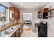 Well-equipped kitchen with granite countertops, stainless steel appliances, and a view to the dining area at 1534 Rosemary St, Denver, CO 80220