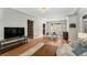 Inviting living room with hardwood floors, stylish furnishings, and open layout to the dining area at 1534 Rosemary St, Denver, CO 80220