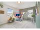 Stylish home office setup with a comfortable desk, ergonomic chair, and abundant natural light at 545 High Point Dr, Longmont, CO 80504