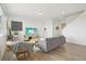 Well-lit living space with stylish decor, hardwood floors, and a comfortable sofa at 545 High Point Dr, Longmont, CO 80504