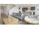 Cozy living room with a view of the modern kitchen and staircase at 545 High Point Dr, Longmont, CO 80504